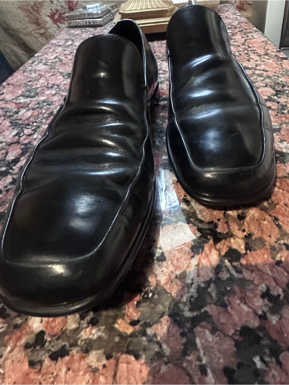 PRADA Men's Black Leather Slip-On loafers.